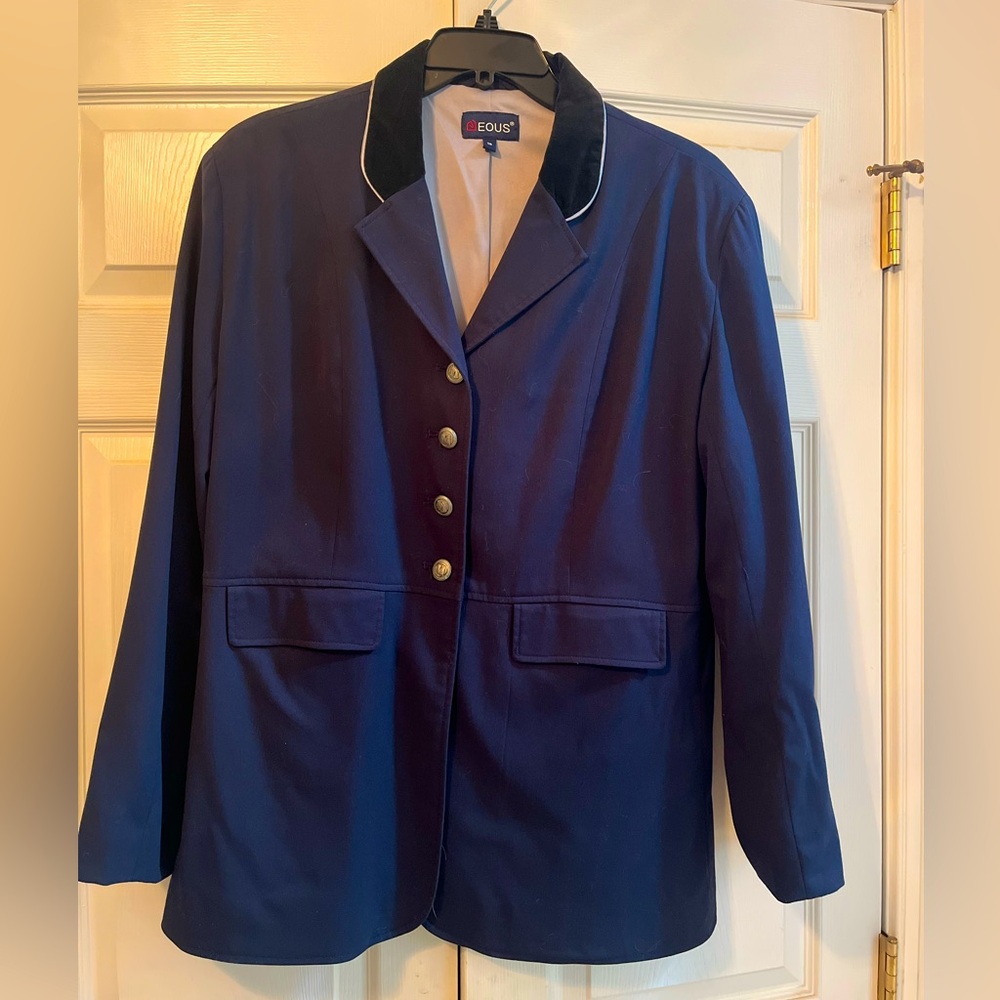 Navy blue EOUS Ladies Dressage coat, with black velvet collar and gray piping.
